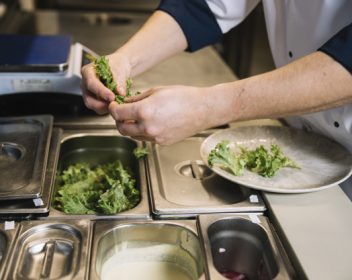 cook-putting-green-lettuce-plate_23-2148040198